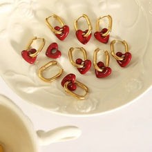 Gold heart titanium steel earrings with oval hoops and red charms
