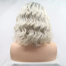 Heat safe ombre blonde wavy wig with dark roots on mannequin