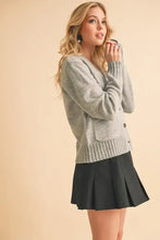 Heather Gray Cardigan with Ribbed Hem Button and Black Pleated Skirt