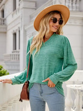 Women’s heathered green long sleeve V-neck sweater