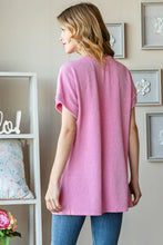 Women’s pink ribbed short sleeve t-shirt with full size letter graphic