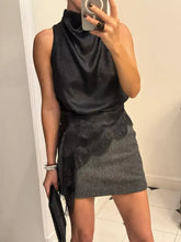 Black satin sleeveless high neck cami with lace trim overlay on skirt featuring high neck lace detail