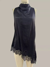 Black satin sleeveless cami with high neck and delicate lace trim along the hem for elegant layering