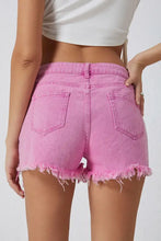 High rise crossover waist pink denim shorts with frayed hem