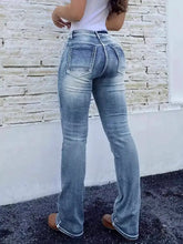 High waist bootcut jeans in light-wash denim with classic back pockets and subtle fading for a stylish casual look back side
