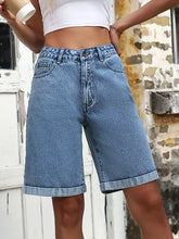 High waist denim shorts in light wash with rolled cuffs