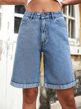 High waist denim shorts in light wash blue with cuffed hem