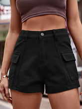 Black high-waisted denim shorts with flap pockets and waist stretch