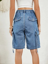 High waist denim shorts with elastic waist and flap pockets