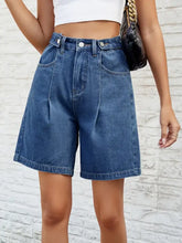 Women’s high-waisted wide-leg denim shorts with pleats and pockets