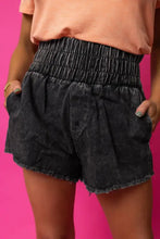 High waist raw hem denim shorts in acid wash black with smocked waistband