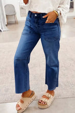 Blue denim high waist straight leg jeans with frayed hems and a straight cut for a modern look