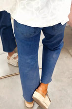 Blue denim high waist straight leg jeans with rolled cuffs and a straight-leg cut for a classic fit