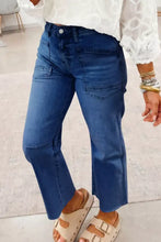 Mid-wash blue high waist straight leg jeans with visible stitching details in durable denim fabric