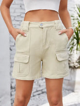 High waist washed denim shorts with beige cargo flap pockets