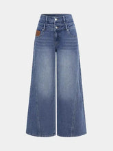 High waist wide leg jeans in medium blue wash denim with button closures and wide legs for a stylish fit