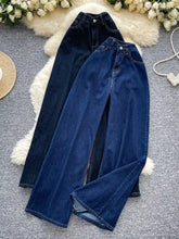A pair of dark blue denim high waist wide leg jeans with button closure and a high waist design