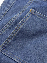 Blue denim high waist wide leg jeans fabric with visible stitching and textured weave detail