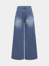 High waist wide leg jeans in blue denim with faded wash and classic back pockets shown from the back side