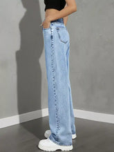 Light-wash denim high waist wide leg jeans with classic stitching and a relaxed fit for casual wear