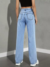 Light-wash high waist wide leg jeans showing the back side with classic denim pockets and wide-leg cut
