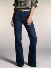 Dark blue high-waisted bootcut jeans in denim with a classic five-pocket design and gold-tone button closure