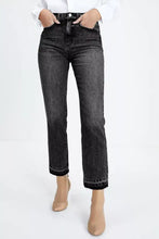 High-waisted black denim jeans with a distressed hem straight leg cut and frayed cuffs for casual wear