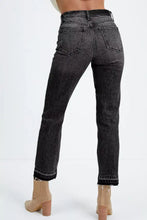 High-waisted black denim jeans with a faded wash featuring a distressed hem straight leg and frayed cuffs