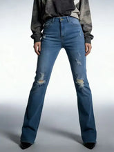 High-waisted blue denim distressed jeans with ripped details on thighs and knees for a trendy casual look