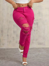 High-waisted distressed skinny jeans in bright fuchsia denim with ripped and frayed edges