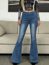High-waisted blue denim flare jeans with classic stitching and a tape measure highlighting sizing details