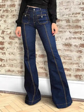 Dark blue high-waisted flare jeans with contrasting light stitching and moderate stretch denim fabric