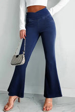Navy blue high-waisted flare jeans made from denim offering a perfect fit and stylish flare silhouette