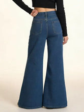 Back side of high-waisted blue denim flare leg jeans with classic pocket design and stylish flare leg fit