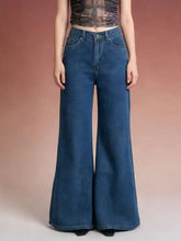 High-waisted blue denim flare leg jeans with classic five-pocket design and button closure