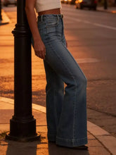 High-waisted flare leg jeans in light blue denim featuring a classic five-pocket design and flare leg style