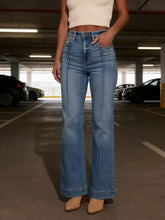 High-waisted flare leg jeans in light blue denim with a straight-leg cut and visible stitching details