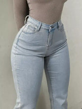 Light-wash denim high-waisted flare jeans with slim fit and classic five-pocket design for stylish wear