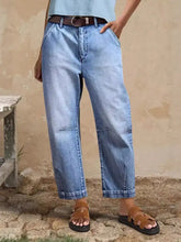 High-waisted light-wash denim relaxed fit jeans with a relaxed straight-leg cut and rolled cuffs