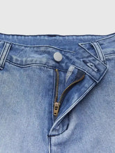 Light-wash high-waisted relaxed fit denim jeans with classic button and zipper closure fit jeans