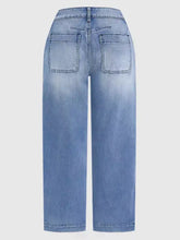 Back view of high-waisted light-wash denim jeans with wide-leg cut and relaxed fit jeans featuring back pockets