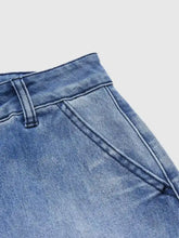 Medium-wash blue denim high-waisted relaxed fit jeans with visible stitching and classic waistband detail
