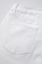 White denim high-waisted straight leg jeans with a minimalist design and subtle stitching details