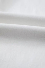 White woven fabric with subtle texture used in high-waisted straight leg jeans featuring straight leg cut design