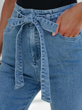 Blue denim high-waisted flare jeans with a self-tie belt featuring tied flare design for stylish wear