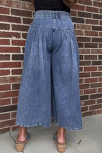 Blue denim high-waisted wide leg button-fly jeans with elasticated waistband and wide-leg cut