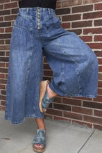High-waisted wide leg blue denim culottes with button-front closure and wide leg button-fly design