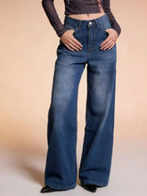 High-waisted blue denim wide leg jeans with classic five-pocket design and subtle fading for a worn-in look