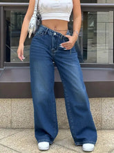 High-waisted wide leg jeans in blue denim featuring classic stitching details and a flattering wide leg fit