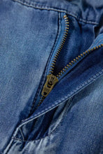 Blue denim high-waisted wide-leg jeans with a brass sbs engraved zipper pull tab for stylish casual wear